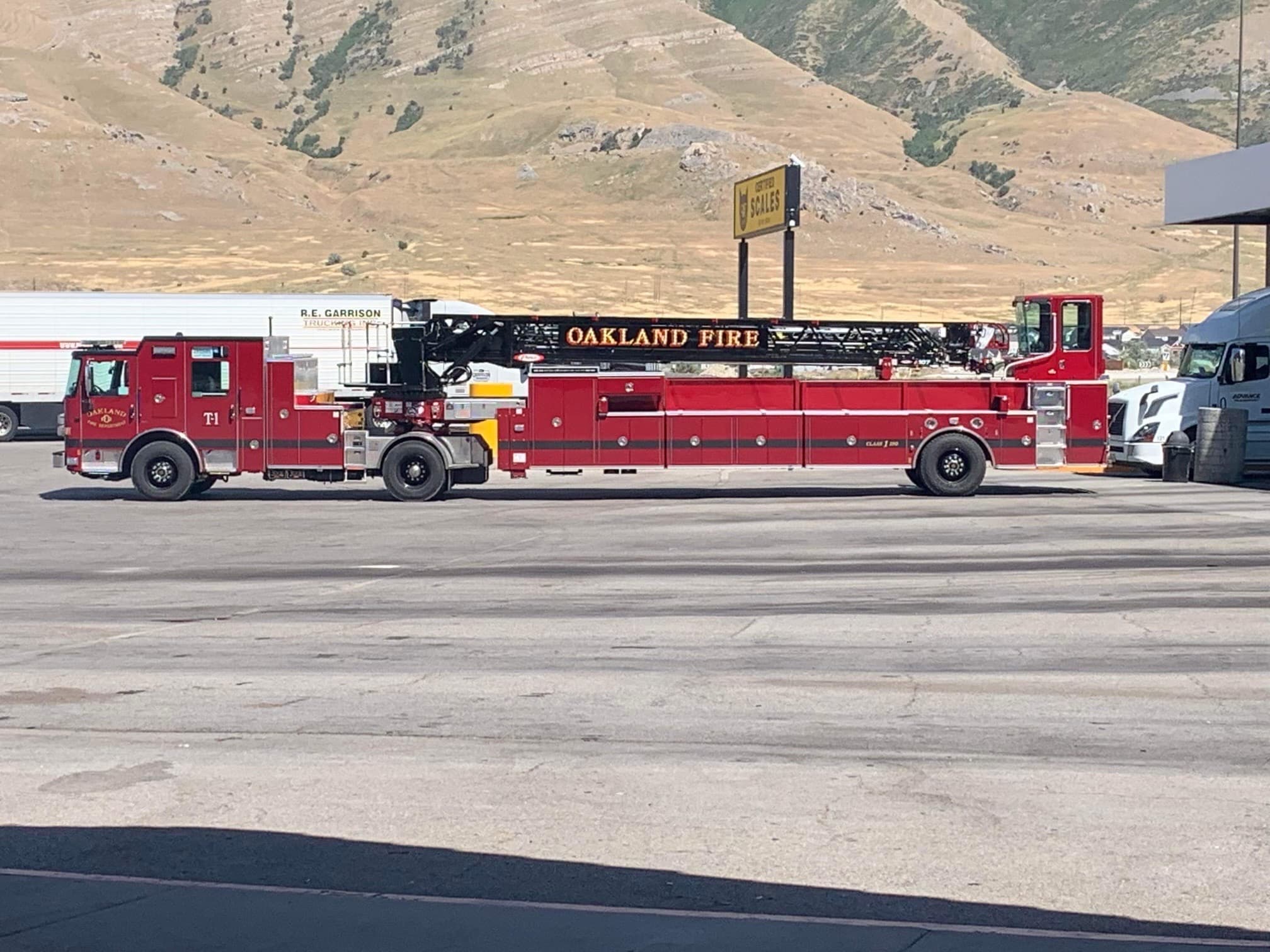 Oakland Fire Department T1 Pierce ladder truck photographed broadside.